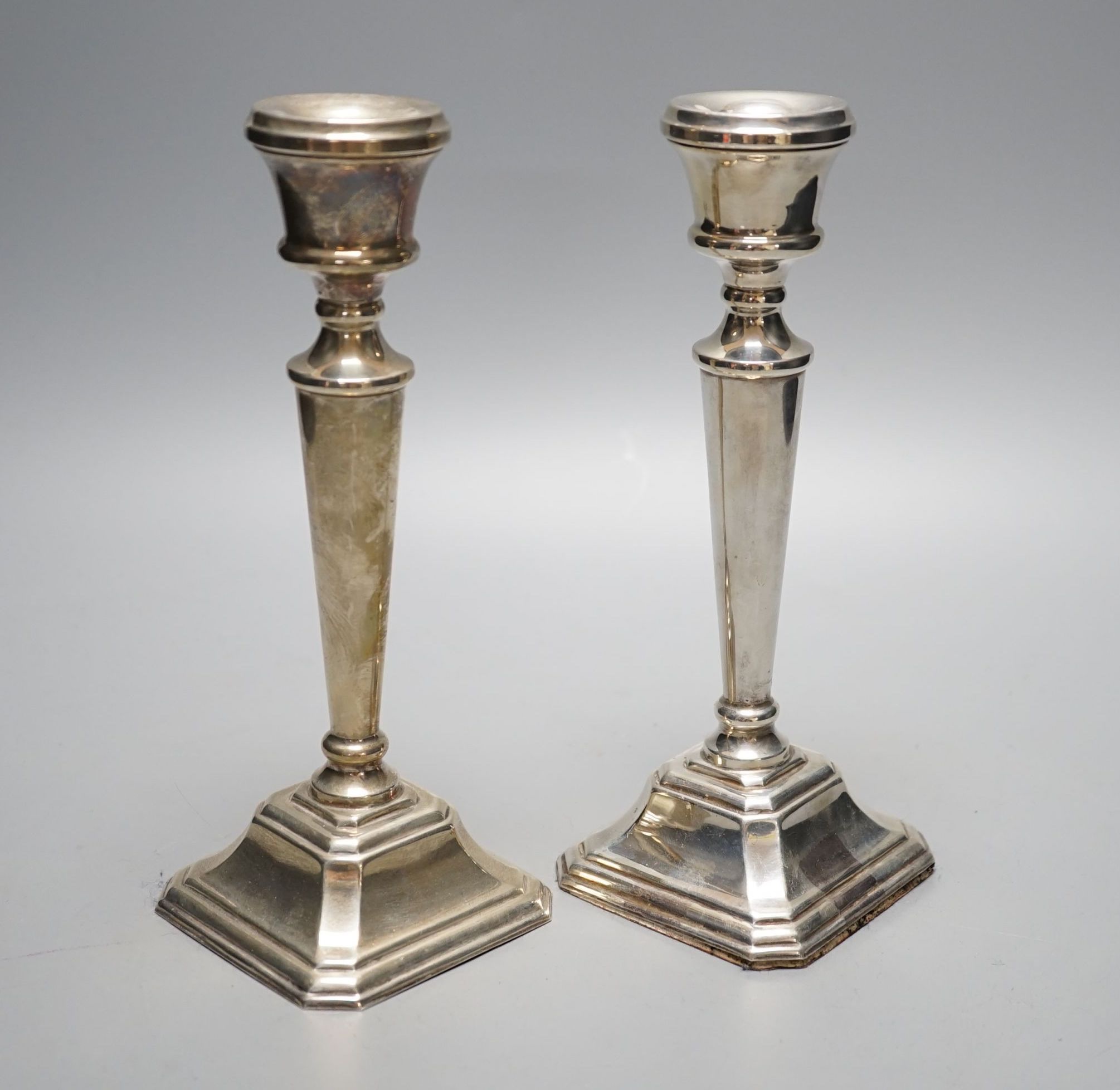 A modern pair of silver mounted candlesticks, JD Ltd, Birmingham, 2000, height 21.5cm, weighted.